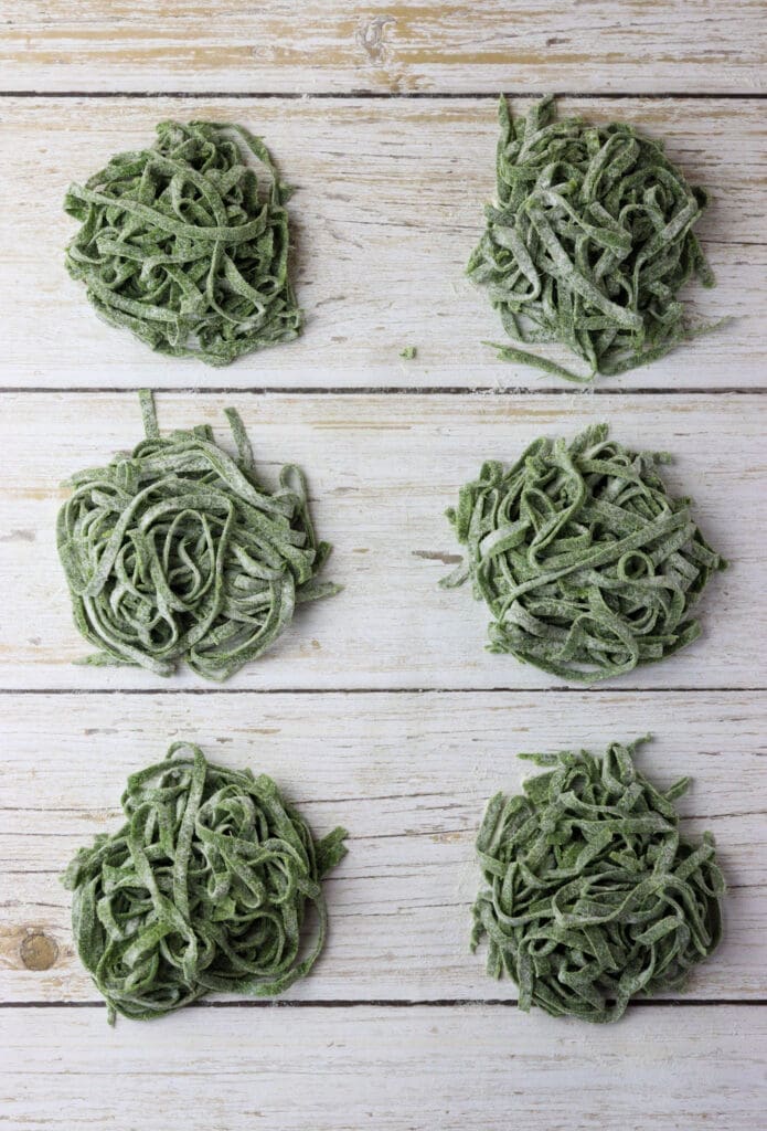 how to lay the green wild garlic pasta noodles into small nests on flour-sprinkled surface before cooking or drying